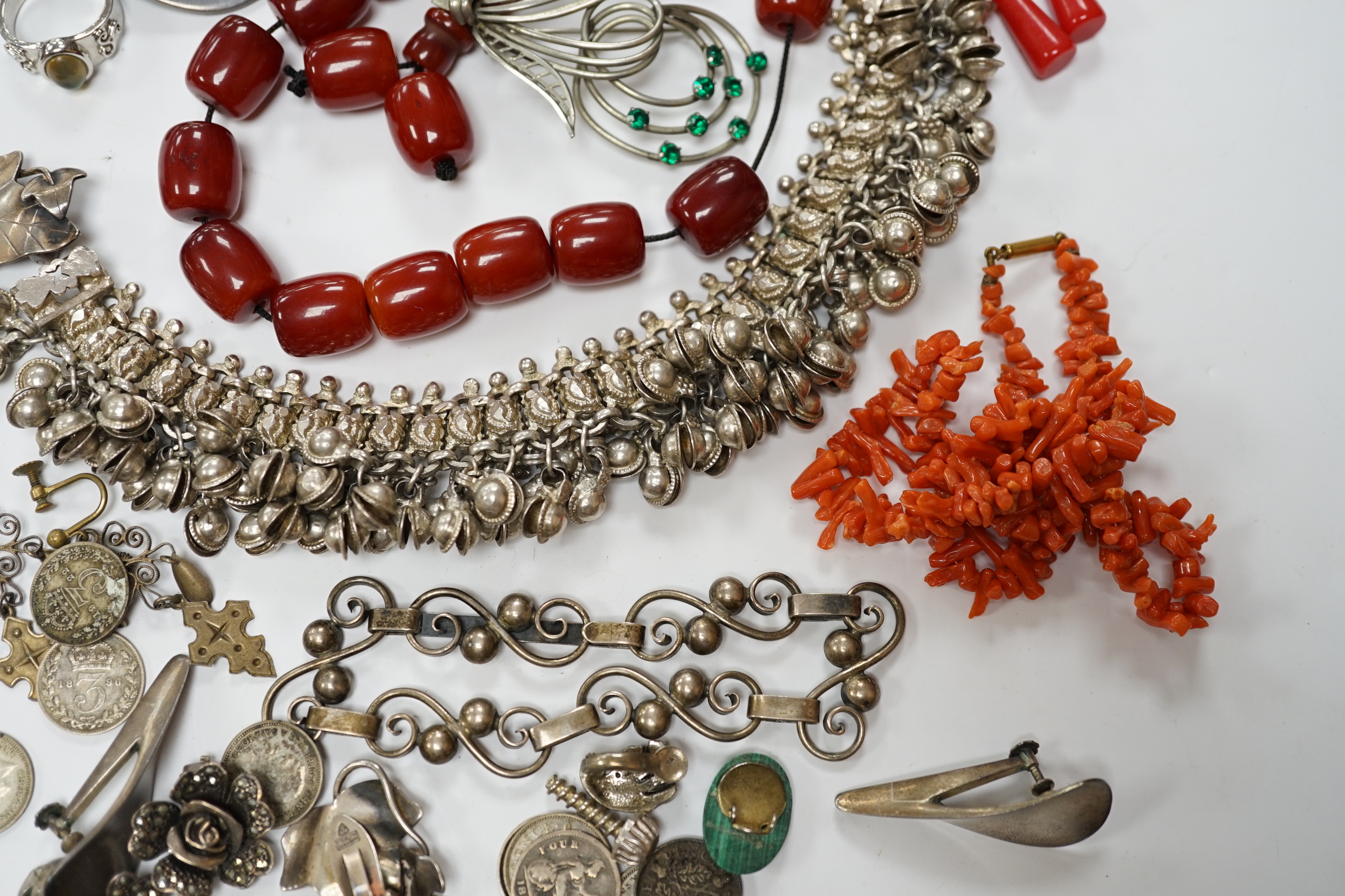 A quantity of assorted jewellery including costume, a pair of Danish sterling ear clips, a 1960's Nanna & Jorgen Ditzel for Georg Jensen sterling silver brooch, no.328, 51mm, a pair of Georg Jensen sterling ear clips, no